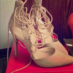 Beige heels with lace up ties